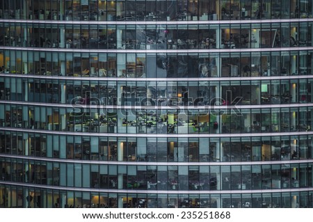 LONDON, UK - DEC 2: people work in an office building in London on December 2, 2014. Fulltime employees in the UK work longer hours than the EU average according to the Office for National Statistics