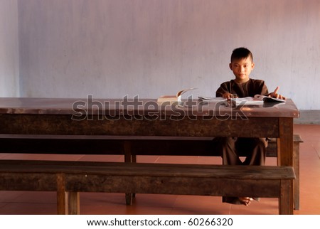 HUE, VIETNAM - SEPTEMBER 3: unidentified buddhist monk studying in Thien Mu Temple in Hue, Vietnam September 3, 2010. Buddhism represents 17% of the population with more than 20mln members  (AsiaNews, 2009)