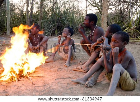 LAKE EYASI, TANZANIA - SEPT 26: Unidentified group of bushmen by the fire near Lake Eyasi, September 26, 2009. In Tanzania 35% of the population is undernourished.(Source FAO)