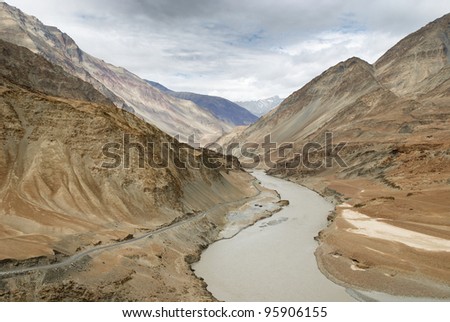 Indus river runs through an arid landscape in Ladakh