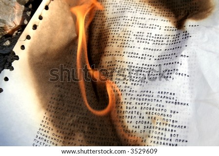 Burning paper with typed russian letters 2