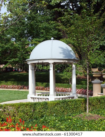 Color DSLR picutre of a domed gazebo in a formal garden; in vertical orientation with copy space for text