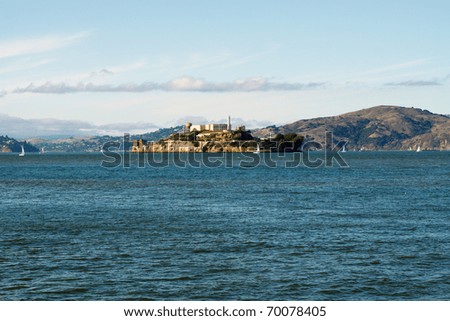 Wide angle view of The Rock, Alcatraz in San Francisco harbor, in horizontal orientation with copy space for text