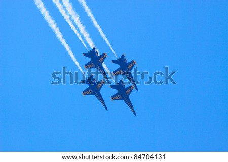 ROCHESTER, NY - JULY 17: Four F/A-18 Hornets of the United States Navy\'s Blue Angels flight demonstration team, performing at an airshow in Rochester, New York, on July 17, 2011.
