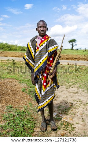 MAASAI MARA, KENYA-DECEMBER 27:  Maasai in traditional clothes 27 December, 2012 at Maasai Mara, Kenya. The Maasai are the most famous tribe in Africa.