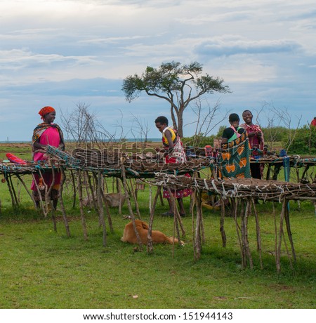 MAASAI MARA, KENYA-DECEMBER 27: Unidentified women sells traditional souvenirs 27 December, 2012 at Maasai Mara, Kenya. The Maasai are the most famous tribe in Africa.