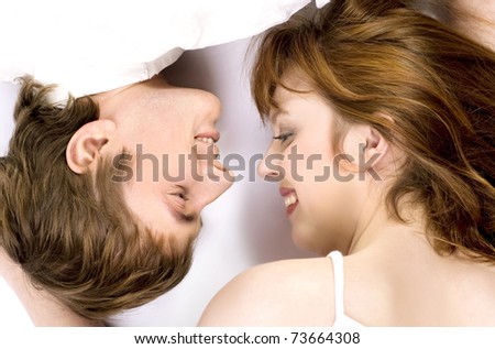 Young cheerful couple touched one another\'s nose