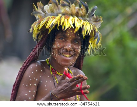 NEW GUINEA, INDONESIA -DECEMBER 28: The woman of a Papuan tribe in traditional clothes and coloring in New Guinea Island, Indonesia on December 28, 2010