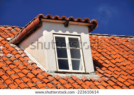 Framed window on the tile roof. California. USA.