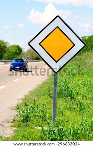 Main road traffic sign and roadside of interurban highway. France.