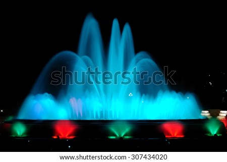 BARCELONA, SPAIN - APRIL 25, 2015: Night show of singing fountains - spectacular display of color, light, music and water motion. The most popular tourist attraction of the city.