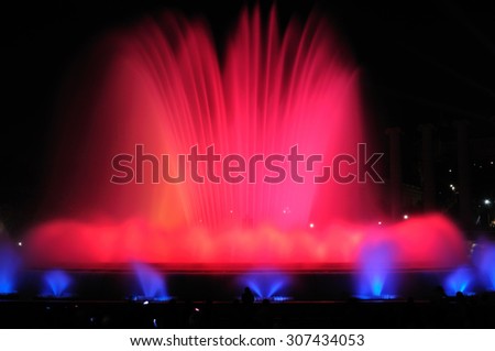 BARCELONA, SPAIN - APRIL 25, 2015: Night show of singing fountains - spectacular display of color, light, music and water motion. The most popular tourist attraction of the city.