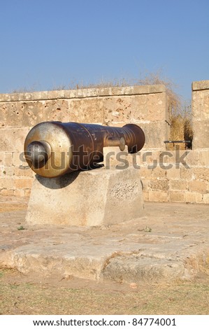 Old gun at the ancient Acre wall. Israel.