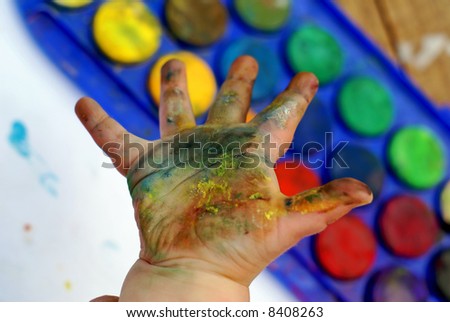 A child\'s hand after doing some hand printing