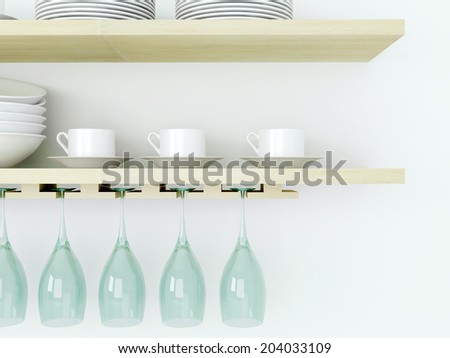 White ceramic kitchenware and wineglasses on the wooden shelf in front of white wall.