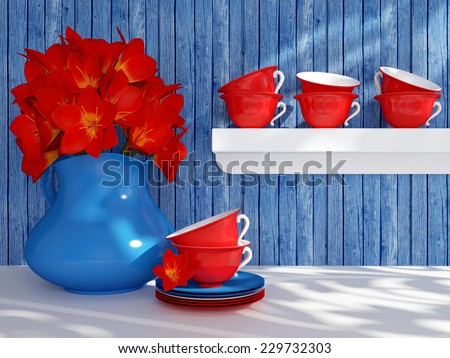 Kitchen still life. Ceramic vase with red flowers and tea cups on the table in front of wooden wall.