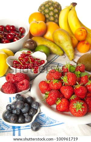 Plenty of summer fruits on a vintage table cloth