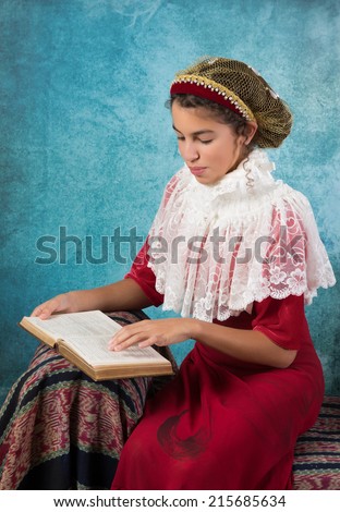Sweet victorian girl posing in the old style with a hair snood