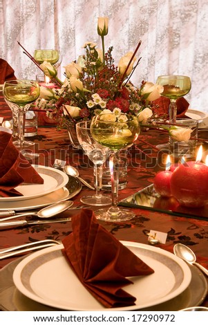 Christmas dinner table with flowers and red napkins