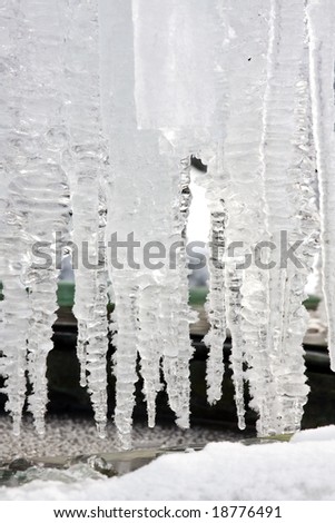 Beautiful hanging icicles covered in white snow