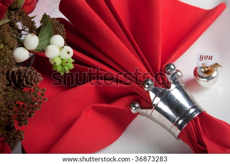 Festive Christmas or wedding table with red napkins on a white tablecloth