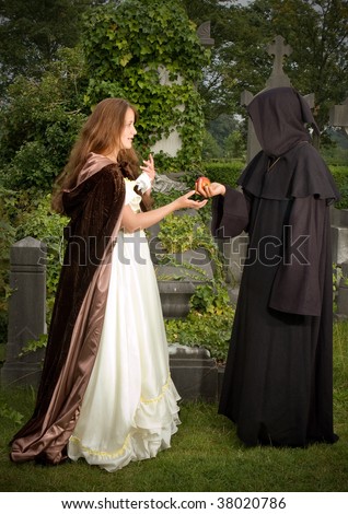 Halloween scene of an evil monk offering an apple to a victorian woman