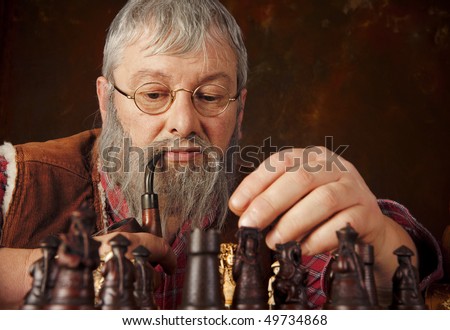 Vintage scene of an old man thinking about his next move in a chess game