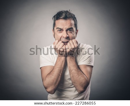 Portrait of man being scared