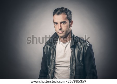 Handsome young man in leather jacket