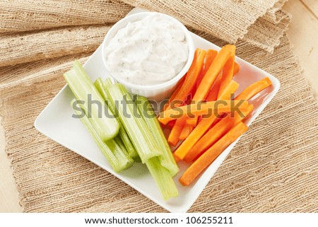 Ranch dressing with fresh carrots and celery