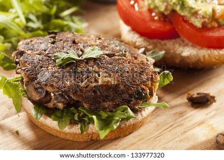 Homemade Organic Vegetarian Mushroom Burger with tomato and guacamole