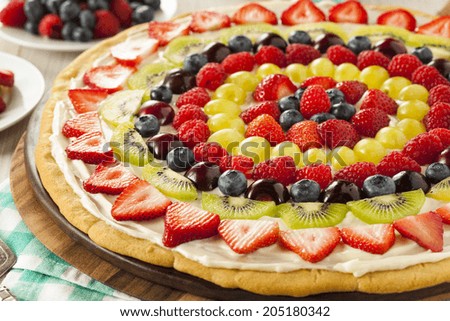 Homemade Natural Fruit Pizza with Frosting and Berries