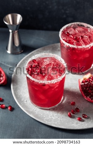 Image, Stock Photo Glass of pomegranate margarita with flower blooms near near feathers