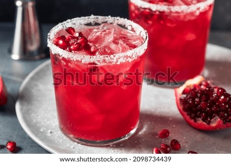 Similar – Image, Stock Photo Glass of pomegranate margarita with flower blooms near near feathers