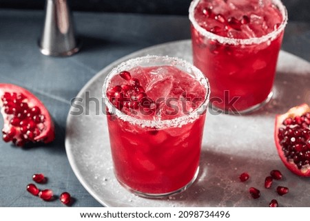 Similar – Image, Stock Photo Glass of pomegranate margarita with flower blooms near near feathers