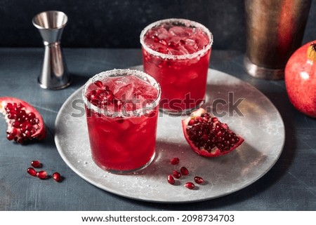 Similar – Image, Stock Photo Glass of pomegranate margarita with flower blooms near near feathers