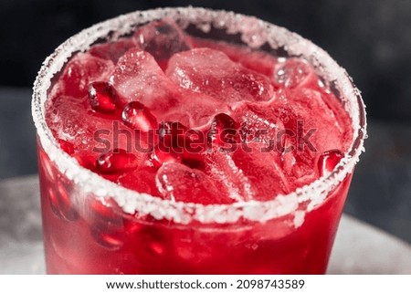 Similar – Image, Stock Photo Glass of pomegranate margarita with flower blooms near near feathers