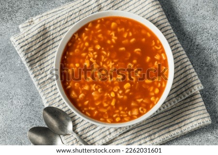 Similar – Image, Stock Photo spoon with letters soup noodles in a white soup plate next to semolina gnocchi and carrot german text hair