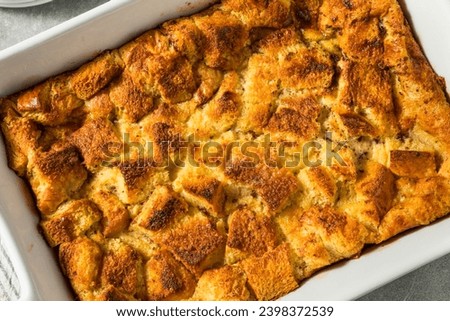 Similar – Image, Stock Photo Sweet bread pudding with orange zest butter