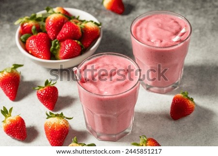 Similar – Image, Stock Photo Strawberry smoothie in a botle with pink background and pink paper straws.