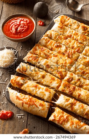 Homemade Cheesy Breadsticks with Marinara Sauce for Dipping