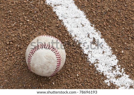 A baseball in on a baseball diamond