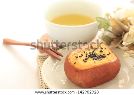 japanese confection, sweet potato cake with roasted sesame and green tea