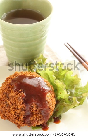 japanese food, mince beef croquette with brown sauce