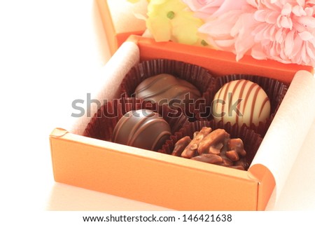 Gourmet dessert, assorted chocolate in gift box with flower bouquet