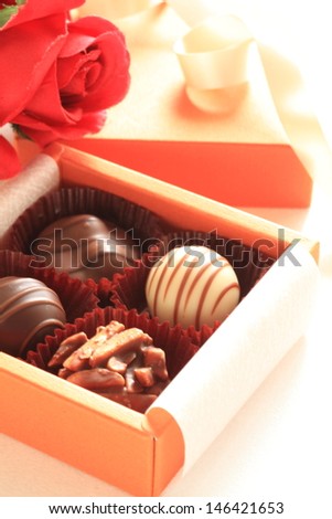 Gourmet dessert, assorted chocolate in gift box with flower bouquet