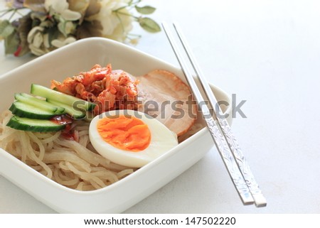 Gourmet Korean cuisine,  Cold noodle with kimchi and roasted pork on top