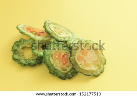 dried vegetable, sliced bitter melon on yellow  background