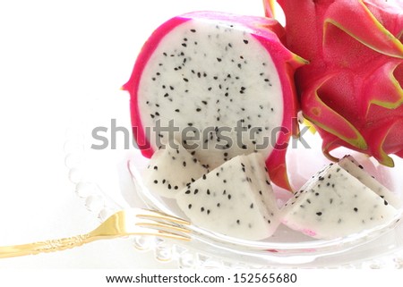 cut dragon fruit on glass dish for gourmet dessert image