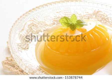 Homemade mango jelly close up on white background